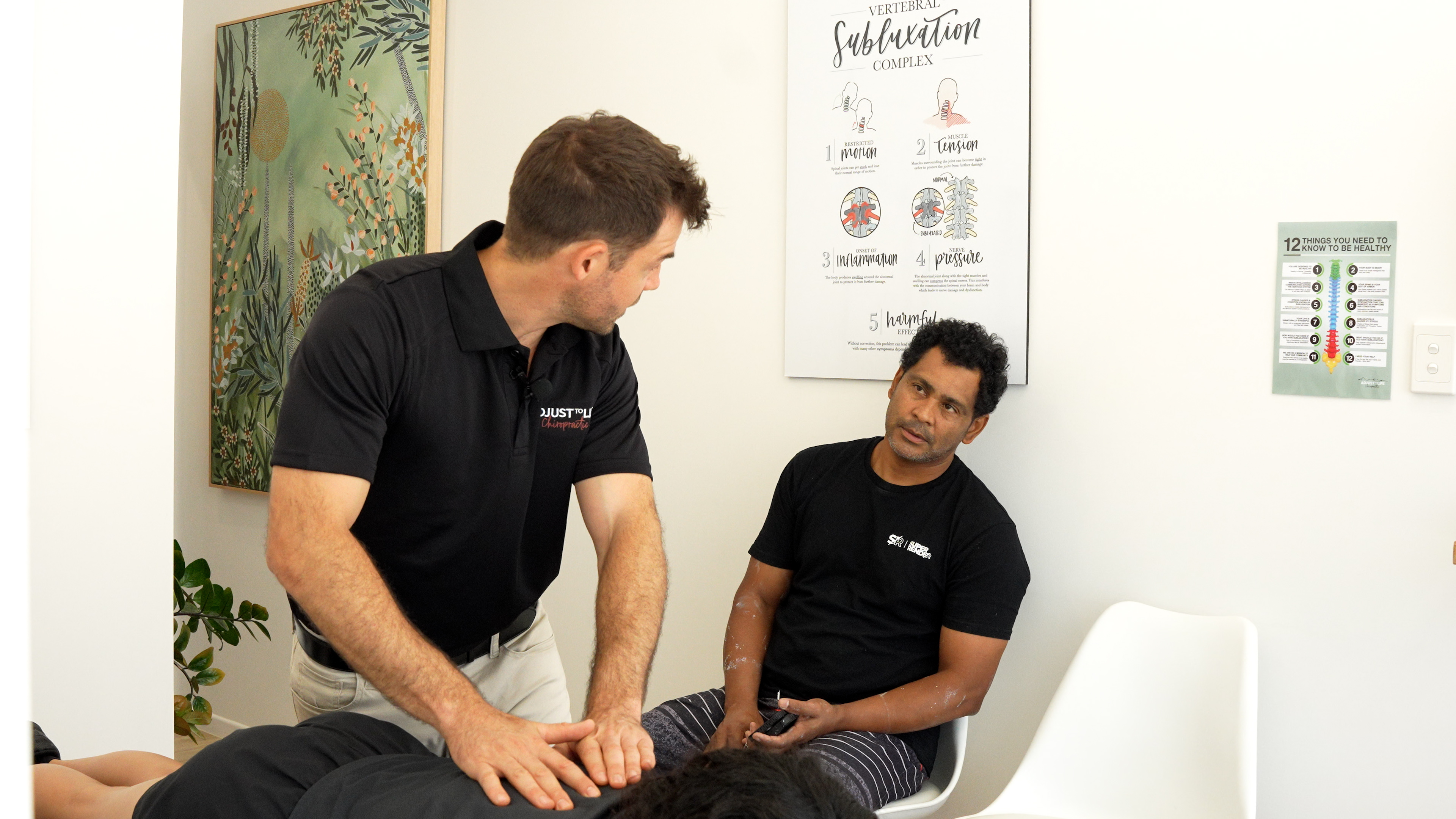 Chiropractor in consultation with a patient